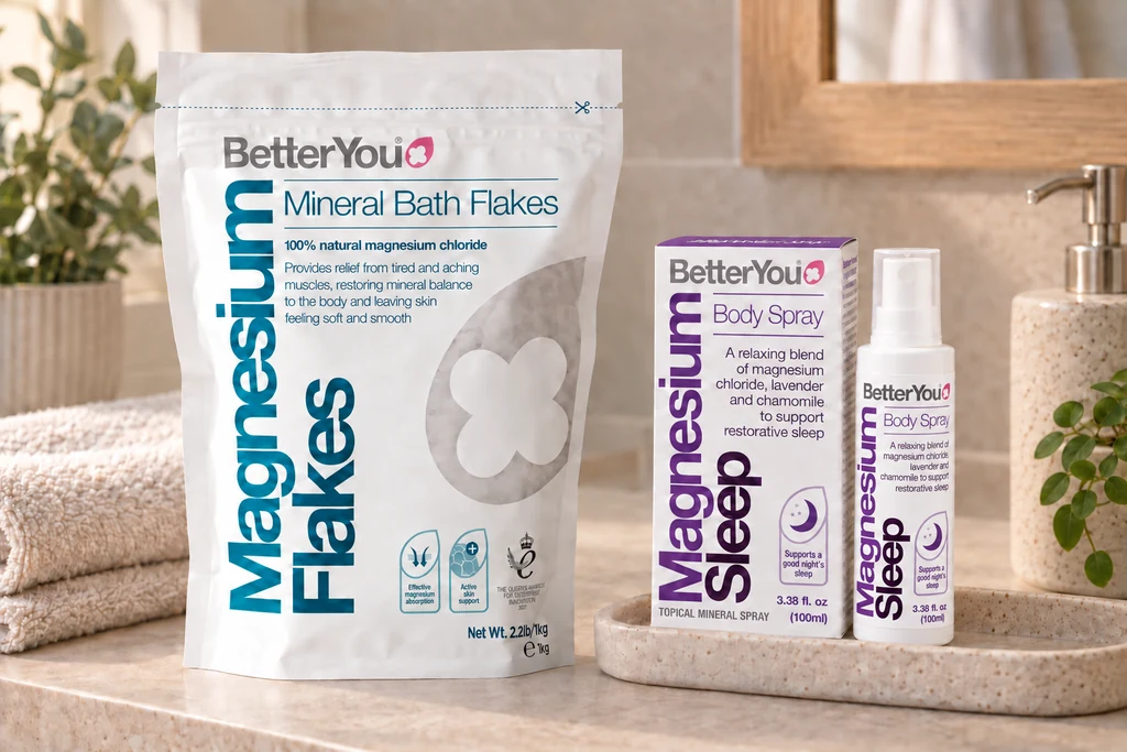 Magnesium bath flakes and a magnesium sleep body spray on a bathroom shelf